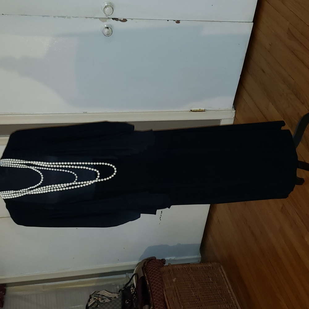 Black jacket and skirt.